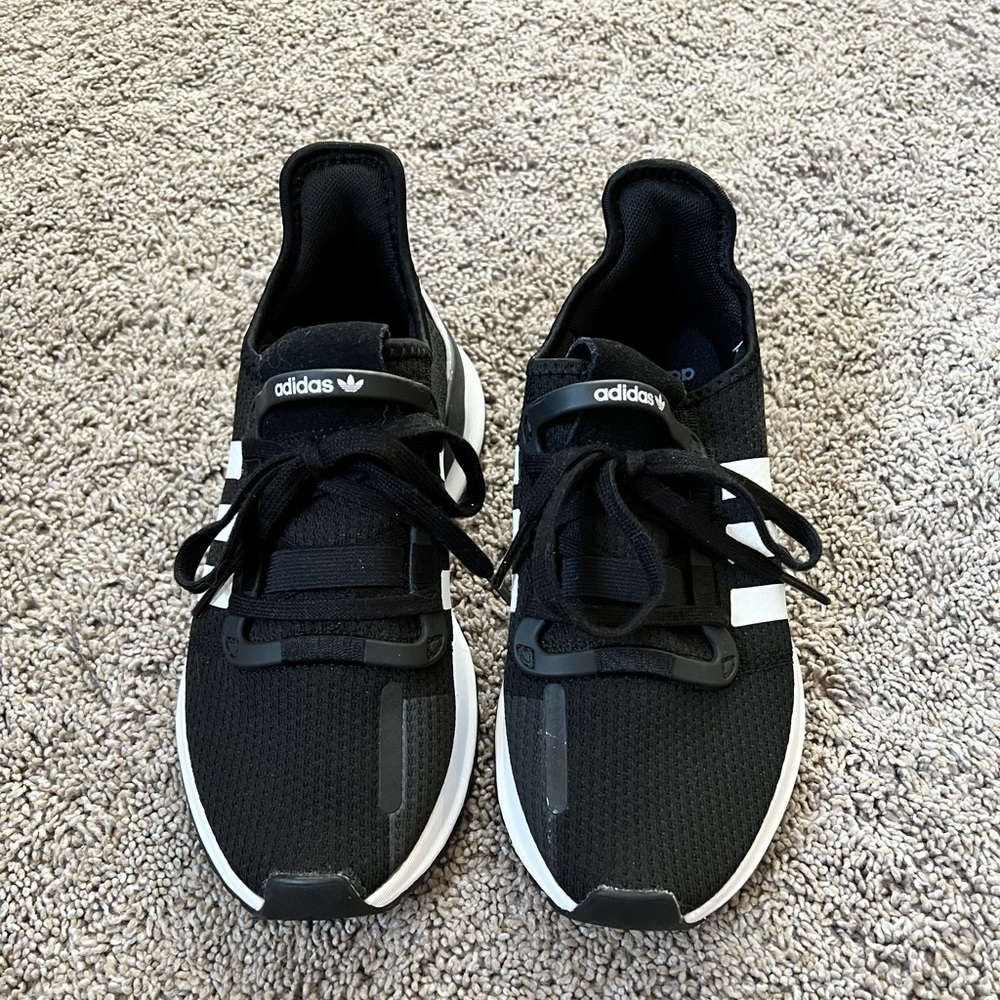 Black and white youth adidas sneakers
